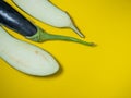 Sliced Ã¢â¬â¹Ã¢â¬â¹eggplant on a yellow background. Vegetables on the table. Beautiful eggplant. Common vegetable